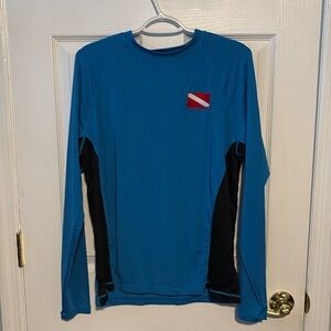 Women’s Large shirt by HUK Tormenter Fishing Products. Worn as dive shirt.